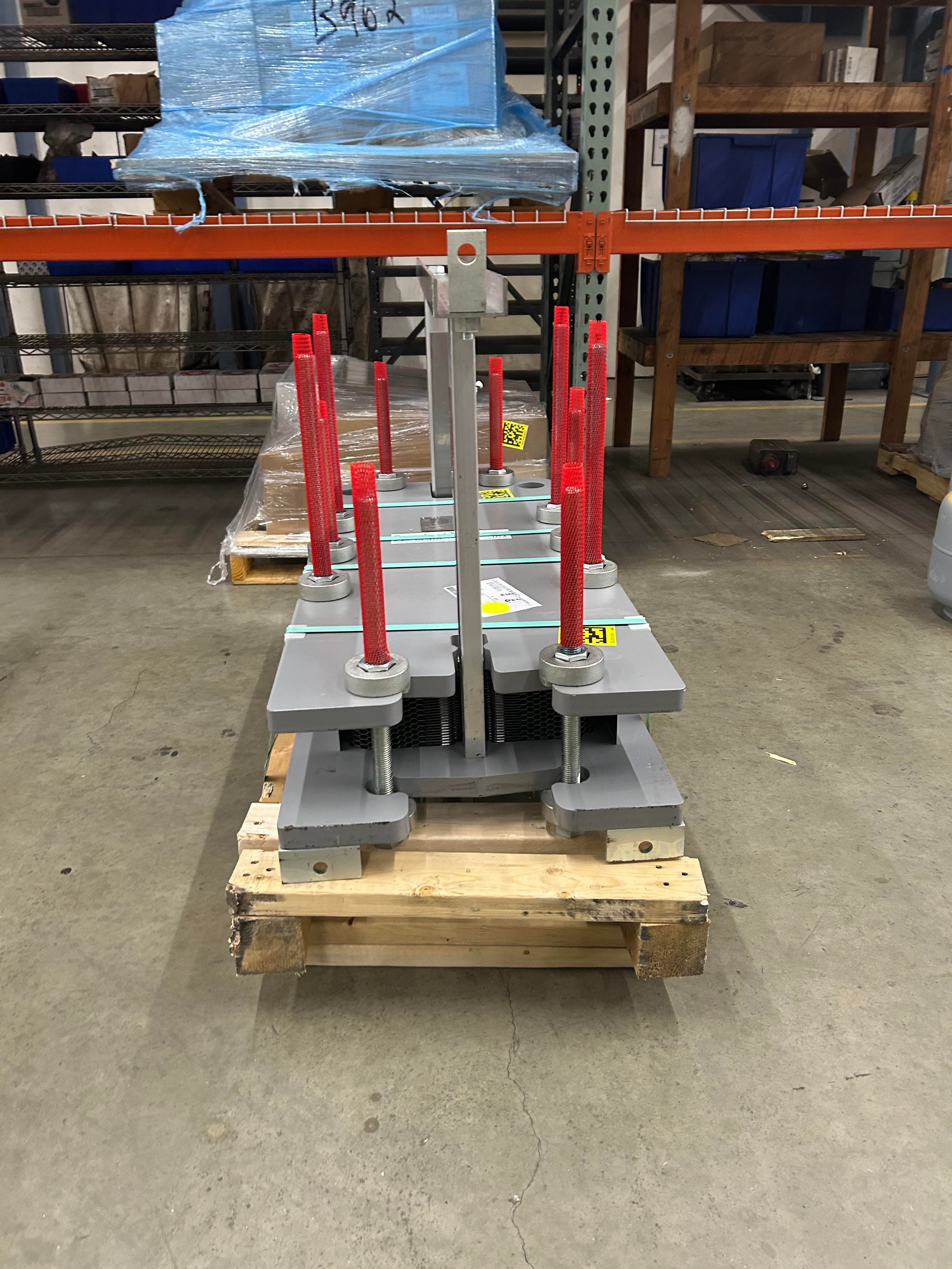 Front view of palletized mechanical equipment prepared for shipment and field handoff.