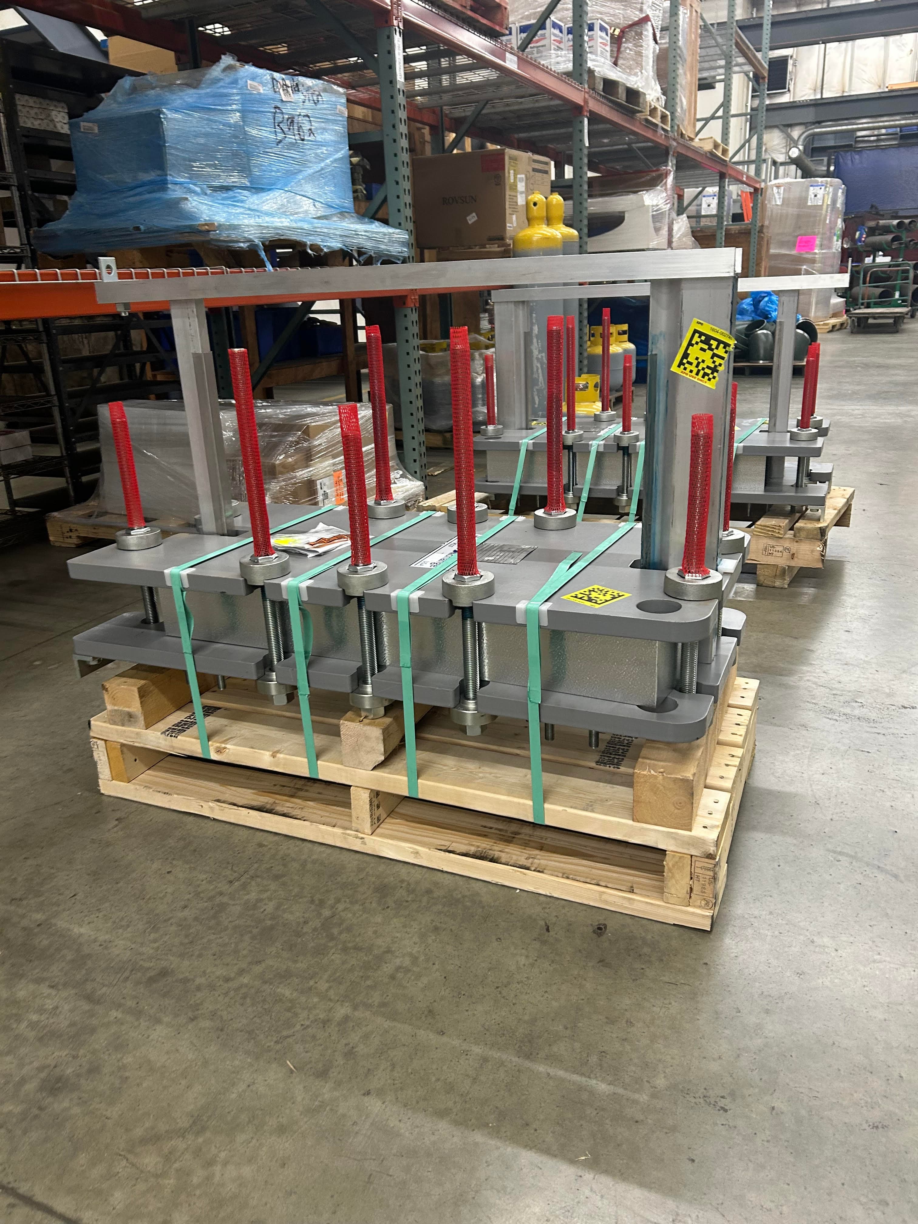 Side view of packaged industrial equipment showing secured transport preparation.